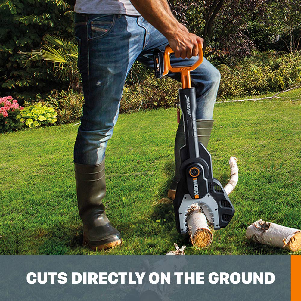 WORX cutting a fallen branch on pavement for convenient ground work