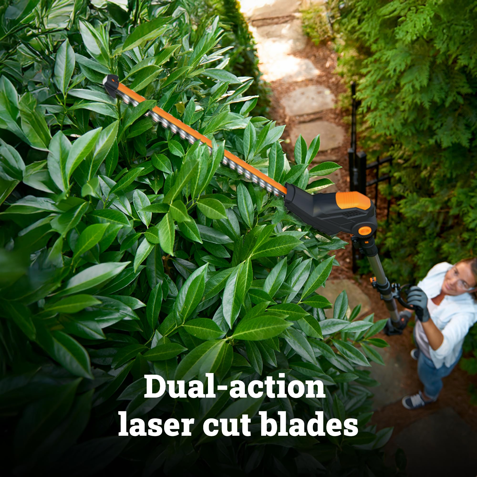 WORX WG252 in use overhead trimming tall hedge for safer work from ground