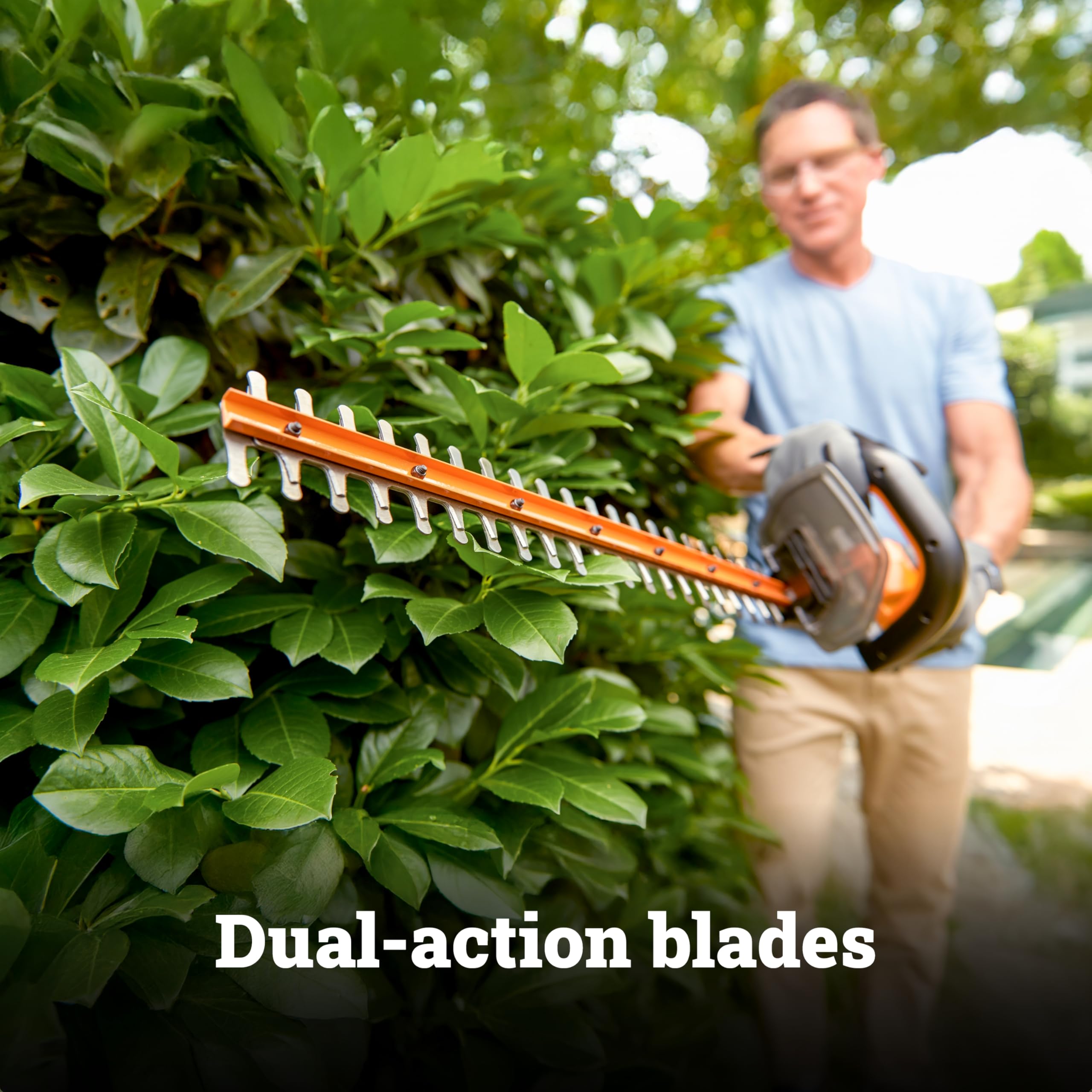 WORX being used overhead to trim tall hedges with less fatigue