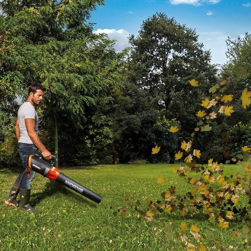 WORX blower in one-handed use on lawn showing ergonomic comfort benefit