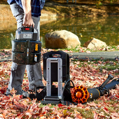 WORX WG572 in-use blowing wet leaves from a driveway to speed yard cleanup