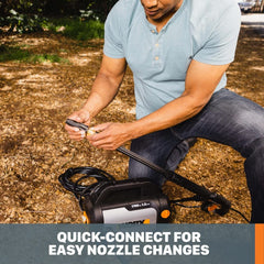 WORX WG602 cleaning a driveway showing powerful spray removing grime quickly