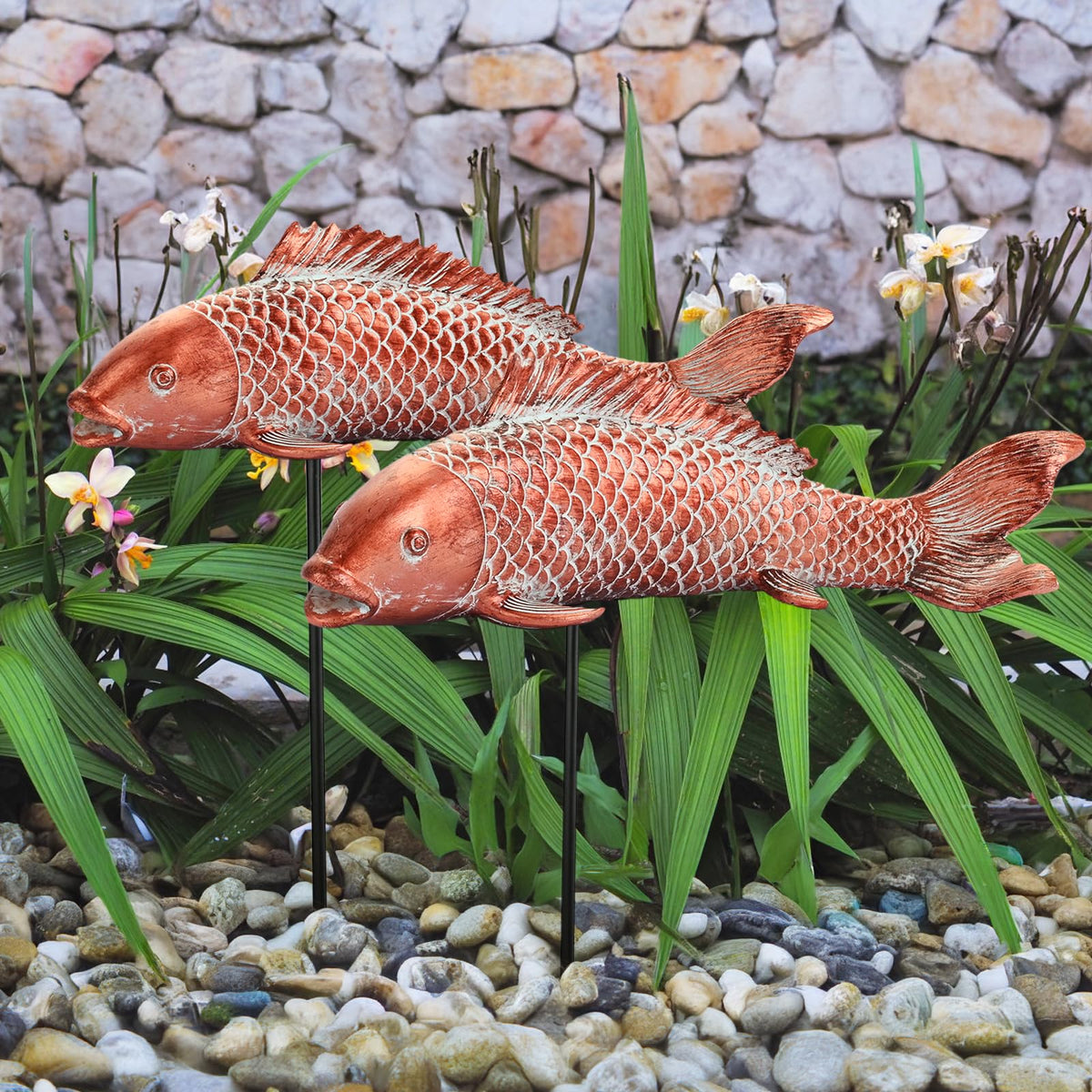Wosuine front view of two koi statues showing decorative balance and outdoor appeal