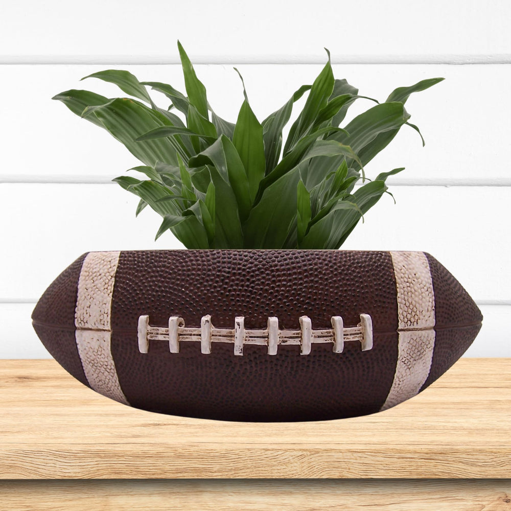 Wowser football planter on mantel styled in living room adding team spirit