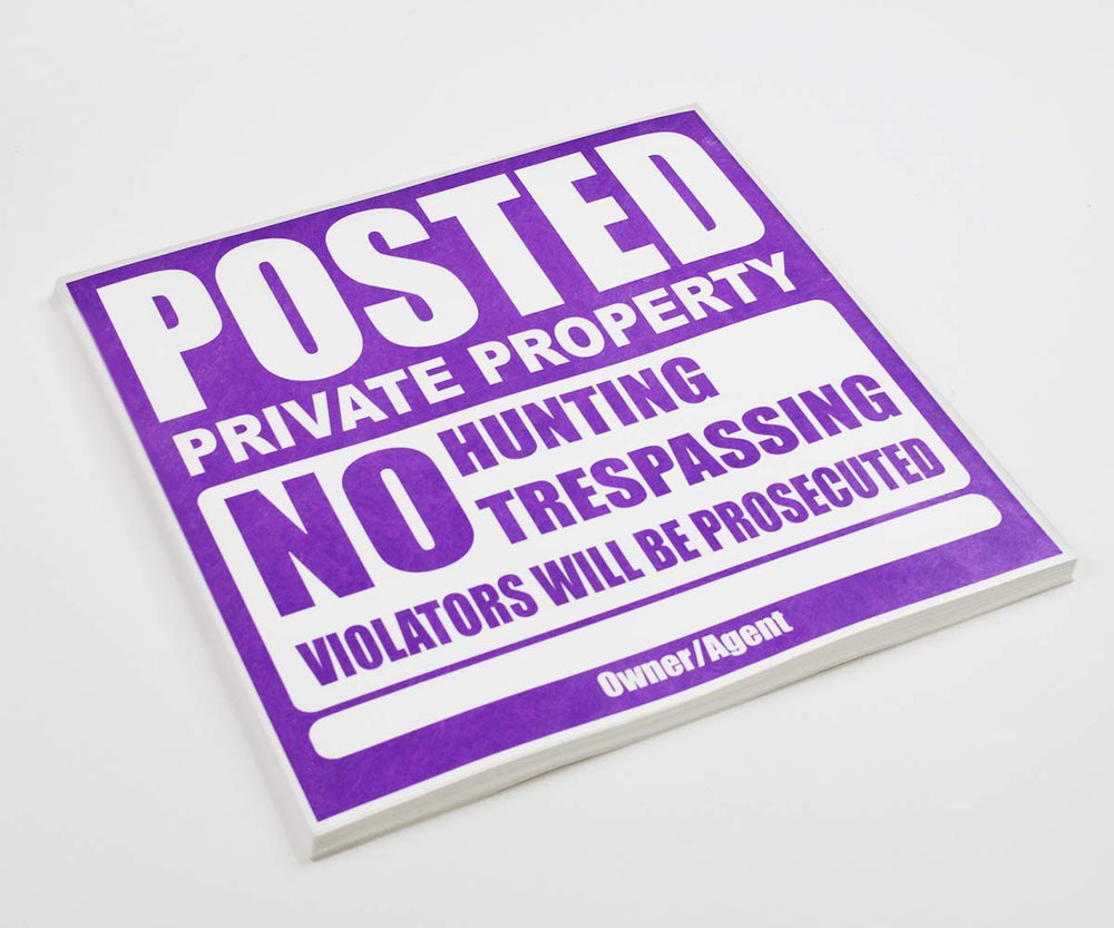 WristCo sign stapled to a wood fence demonstrating easy outdoor mounting and clarity