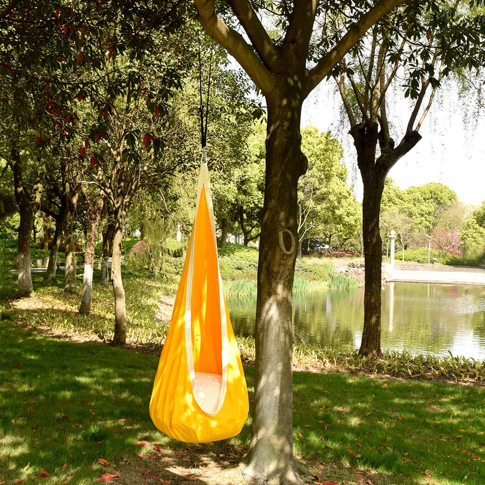 WUBOTIYU swing next to child for scale showing generous interior size