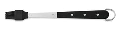 Wüsthof tongs in use over grill delivering precise secure grip