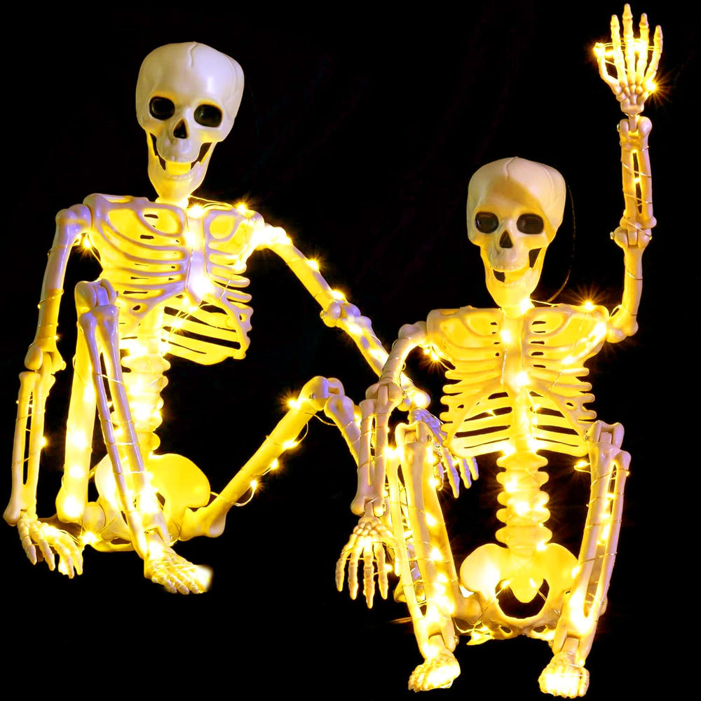wymulot front-facing two-pack skeletons on table, adds instant Halloween atmosphere