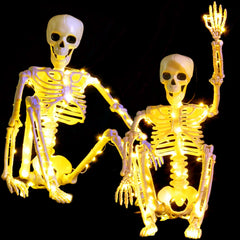 wymulot front-facing two-pack skeletons on table, adds instant Halloween atmosphere