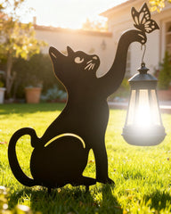 XFzzrsdz black cat front view showing garden charm and soft illumination