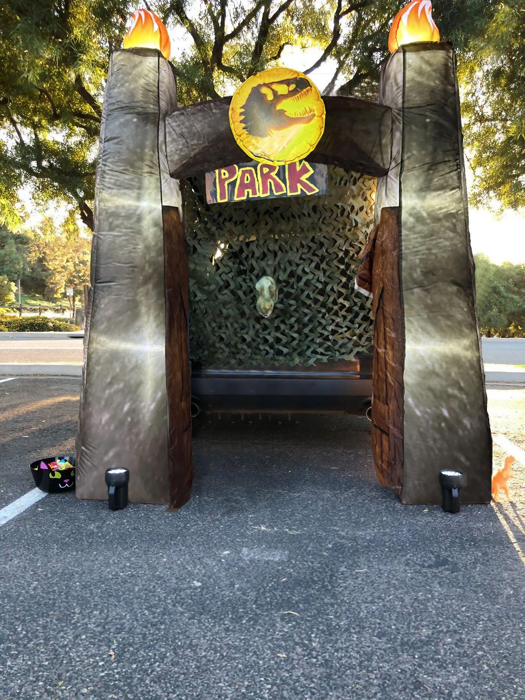 xutengy front view inflatable dinosaur arch showing spooky centerpiece and curb appeal