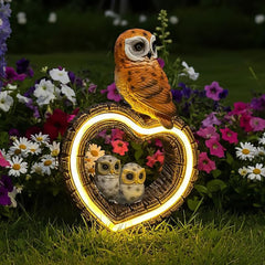 xxoasis front view of owl statue showing heart light and family motif benefit decorative focal point