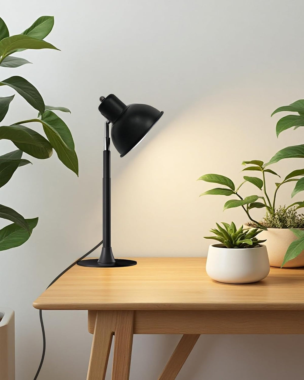 yadoker installed over hanging plants illustrating even illumination across large leaves and multiple pots