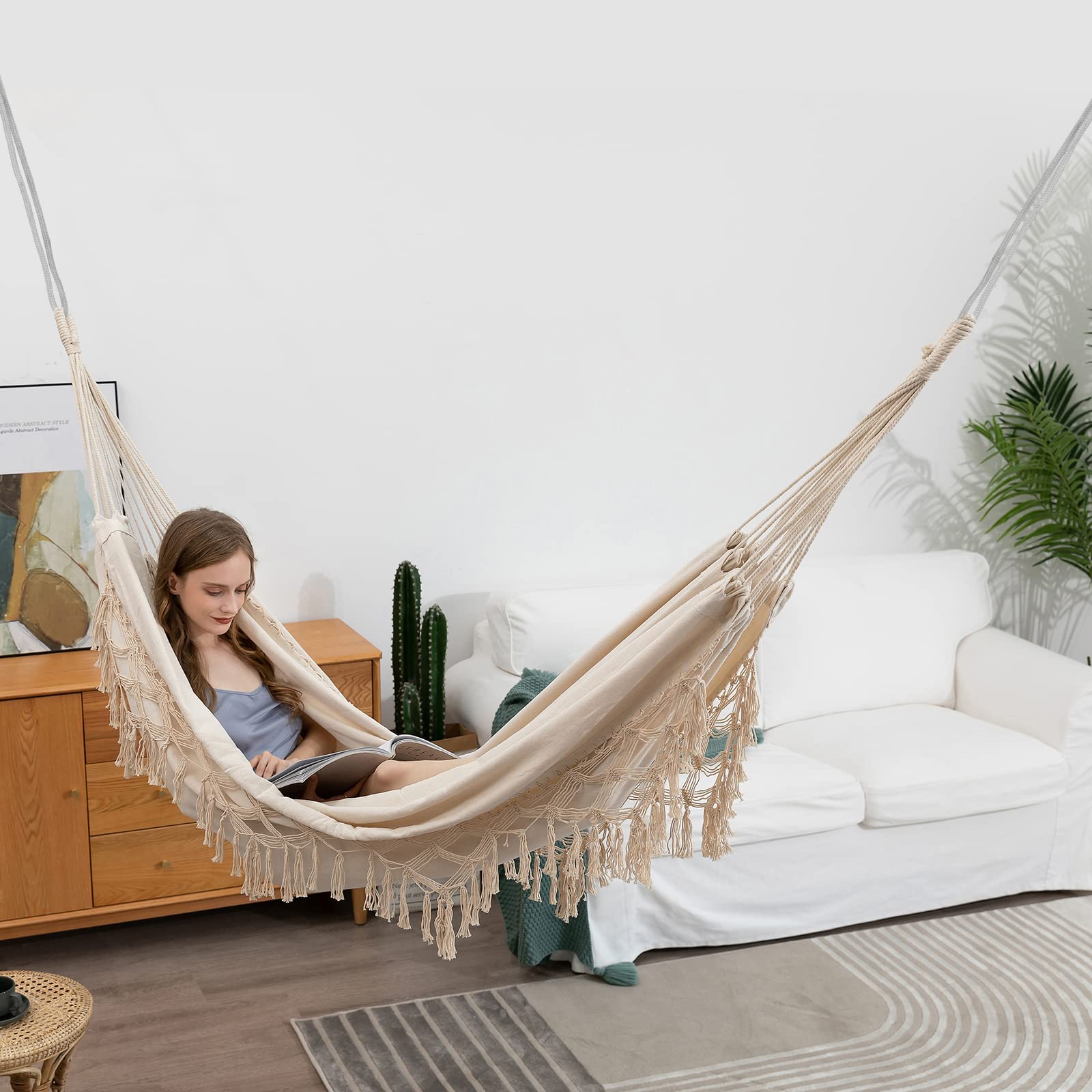 YAERSI hammock hung on patio illustrating cozy lounge and decorative outdoor benefit