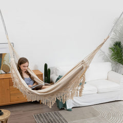 YAERSI hammock hung on patio illustrating cozy lounge and decorative outdoor benefit