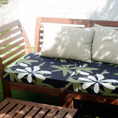 Yalikop on a patio sofa demonstrating protection and coordinated look