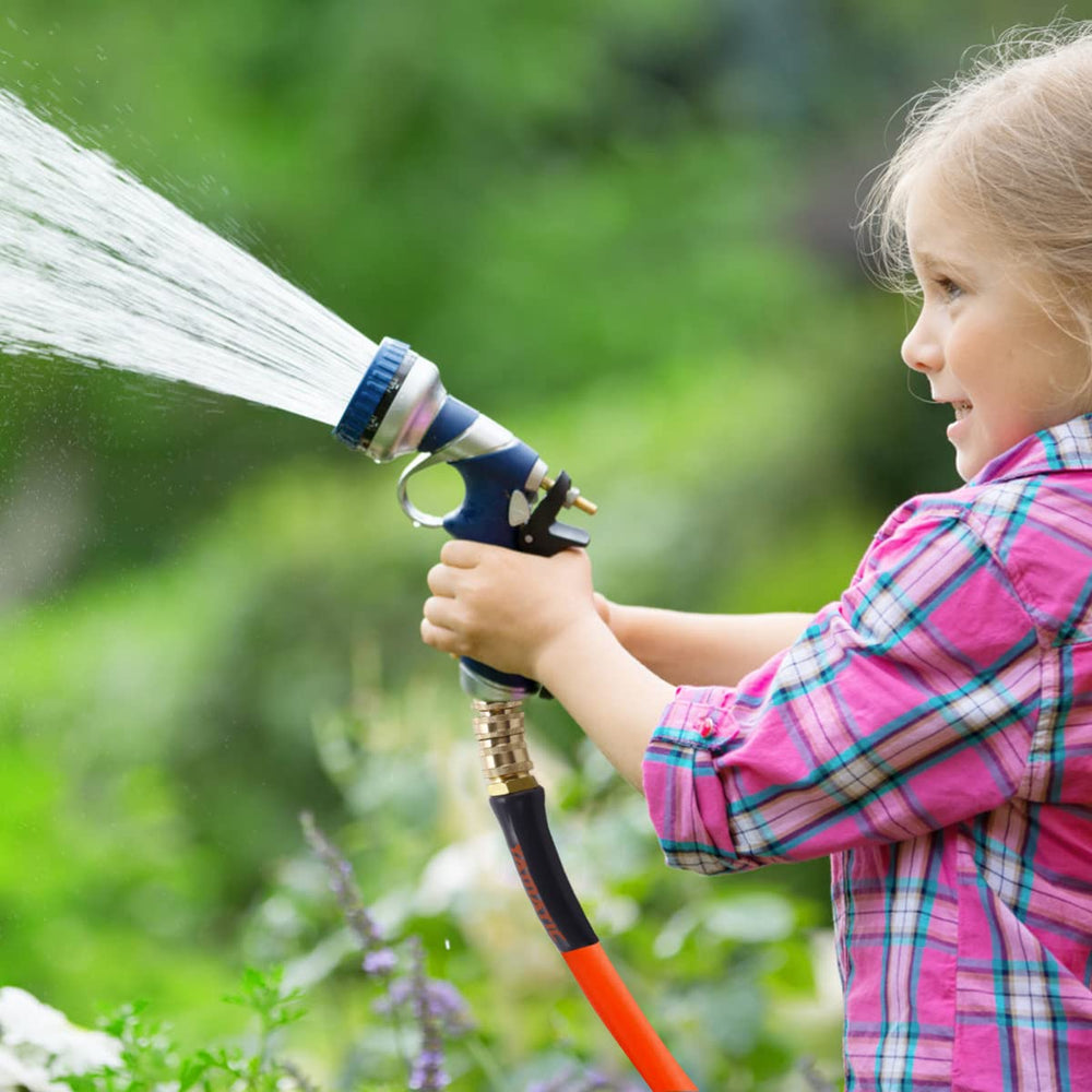 YAMATIC fittings attached to sprinkler in yard, simplifying watering tasks