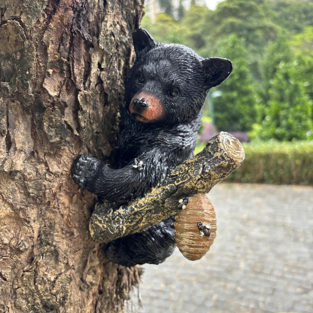 Yaoemei bear hung on tree trunk showing charming outdoor placement benefit