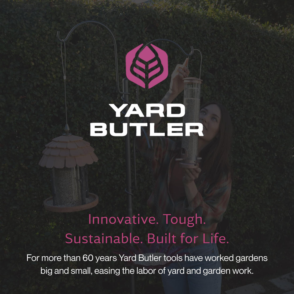 Yard Butler in garden with plants and feeders, enhances outdoor décor