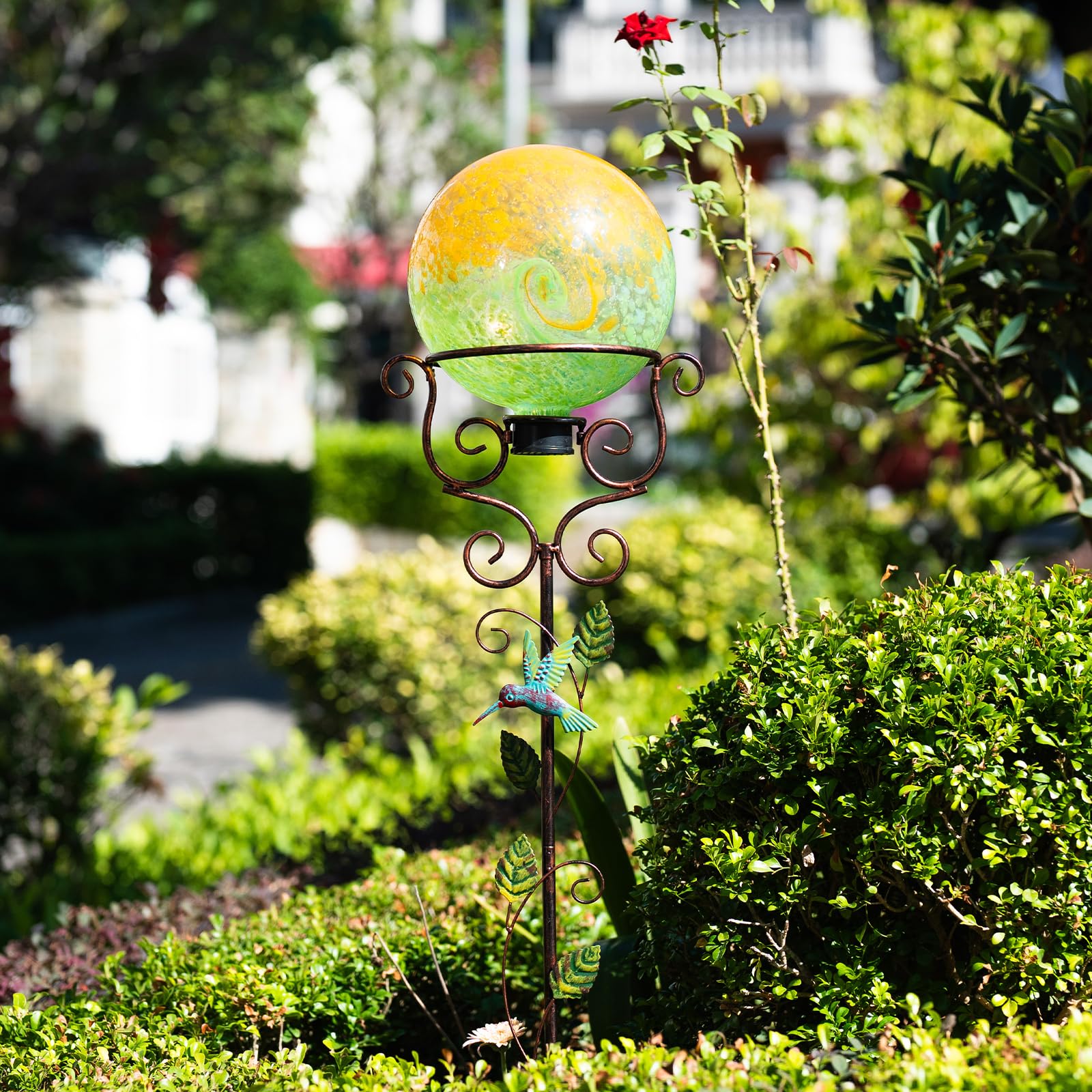 YELENEW stand holding a glass gazing ball in garden to reflect surroundings