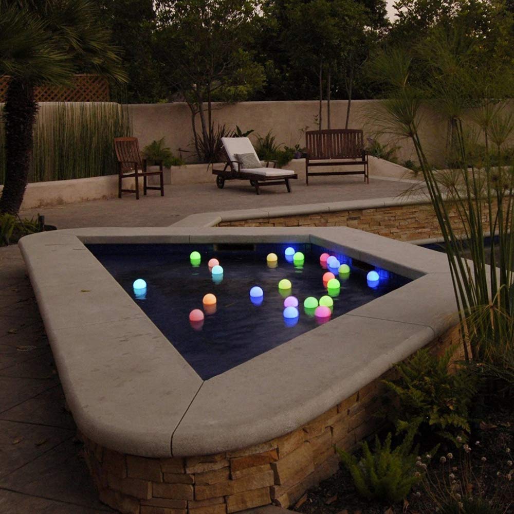 YESIE orb resting on pool step to show size and stable flat base for safety