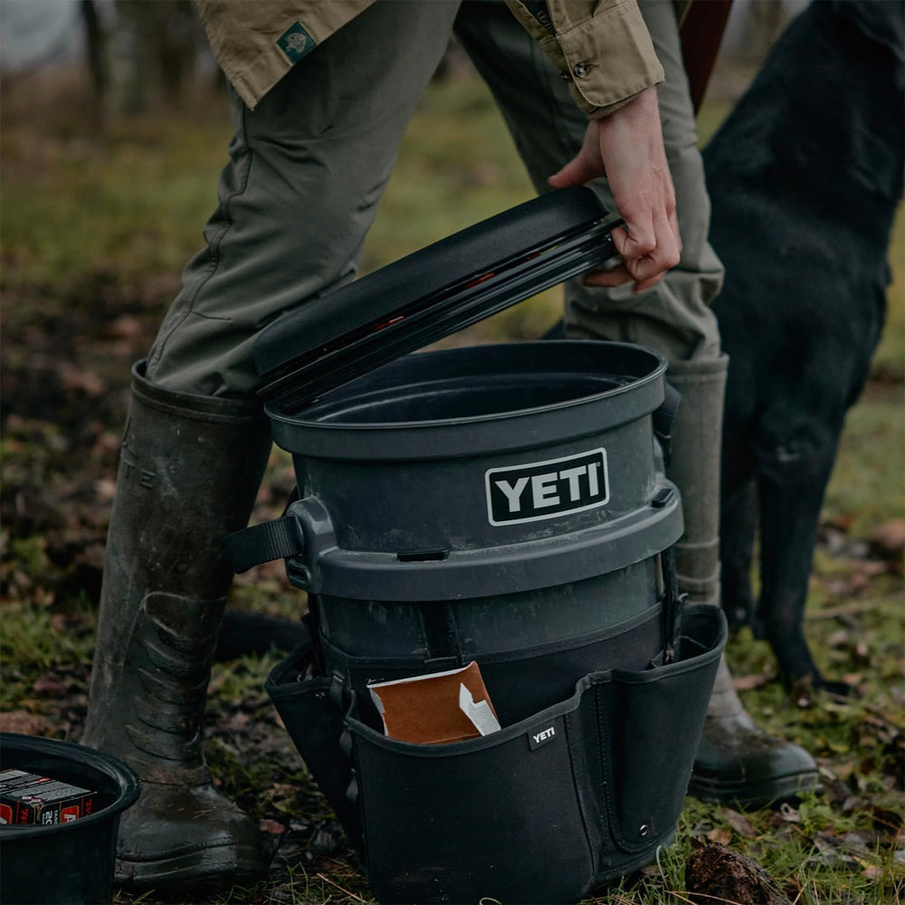 YETI bucket opened under seat revealing weather-resistant seal protecting stored gear from moisture