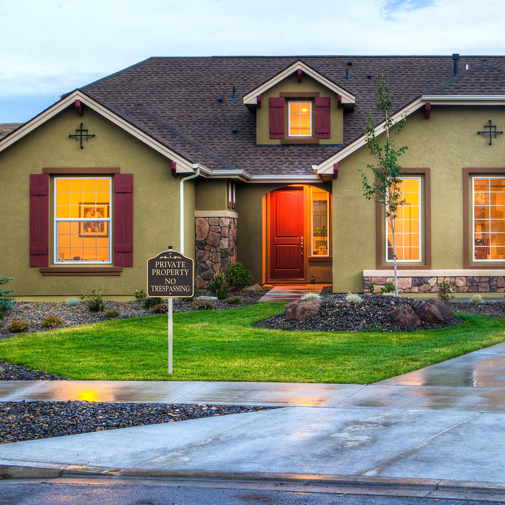YHAIATTA two signs placed in a yard offering dual-location property protection
