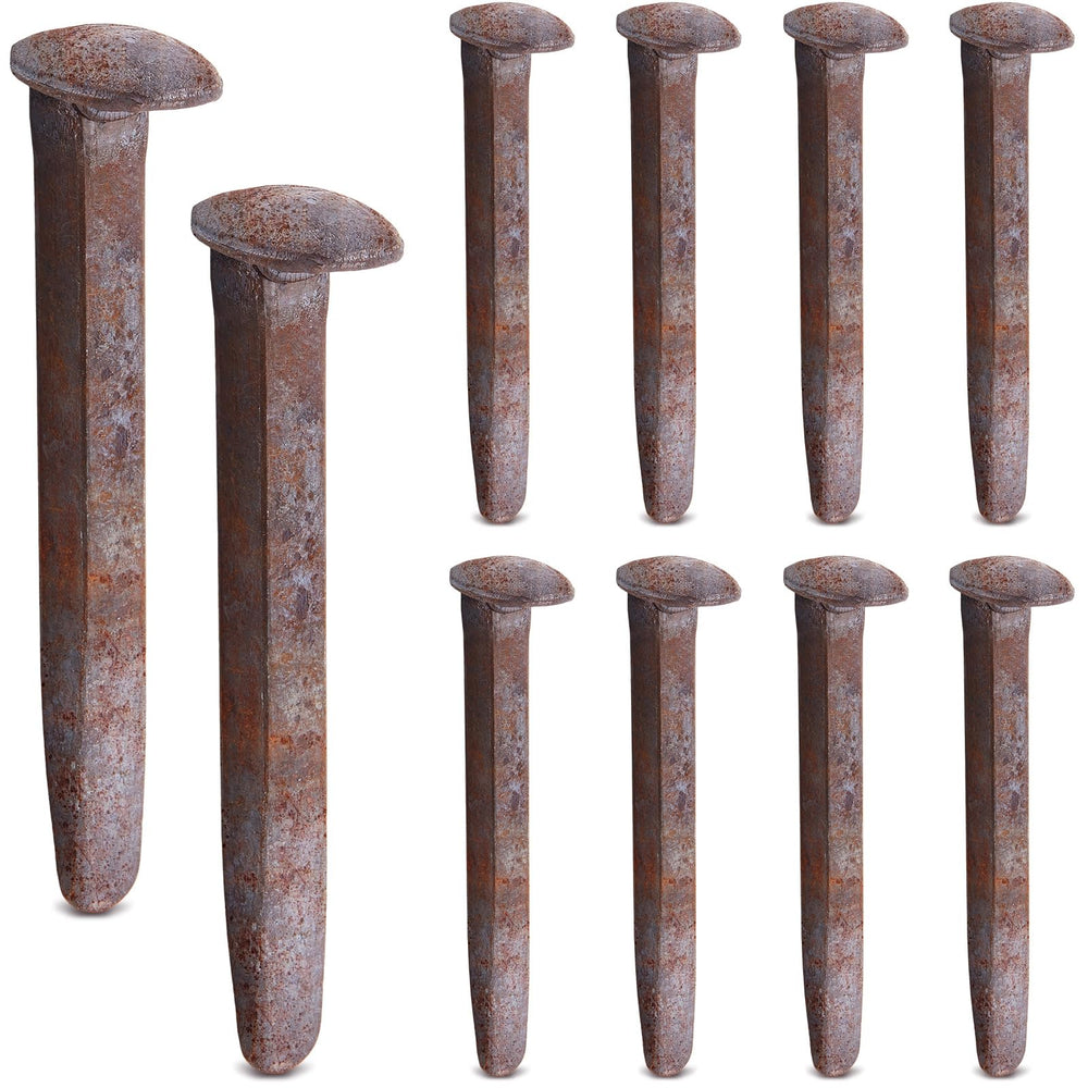 Yinkin front view of ten corroded railroad spikes for vintage décor