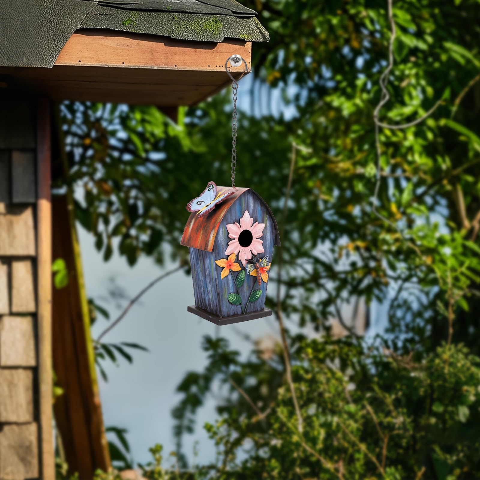 Yinns birdhouse held in hand showing compact size and easy handling