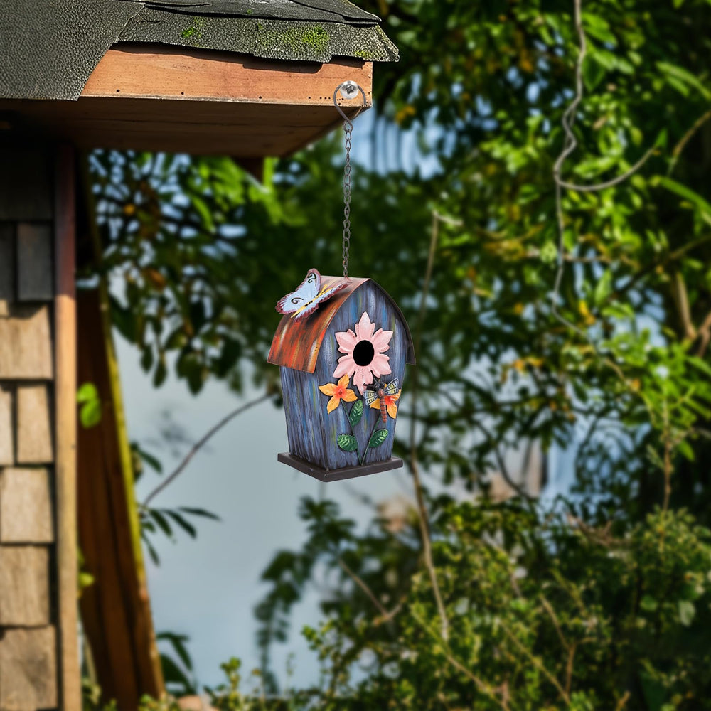 Yinns birdhouse held in hand showing compact size and easy handling