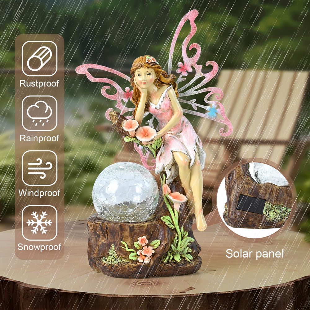 Yiosax fairy placed in flower bed adding whimsical decor and soft lighting