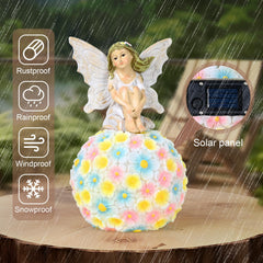 Yiosax fairy placed in a garden bed, adds charm and visual interest outdoors