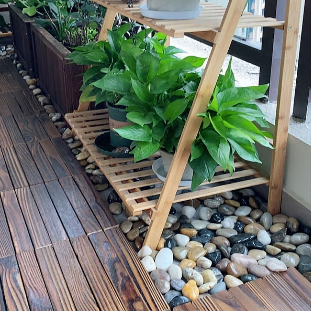 YISZM pebbles used as top dressing in a plant pot for moisture retention