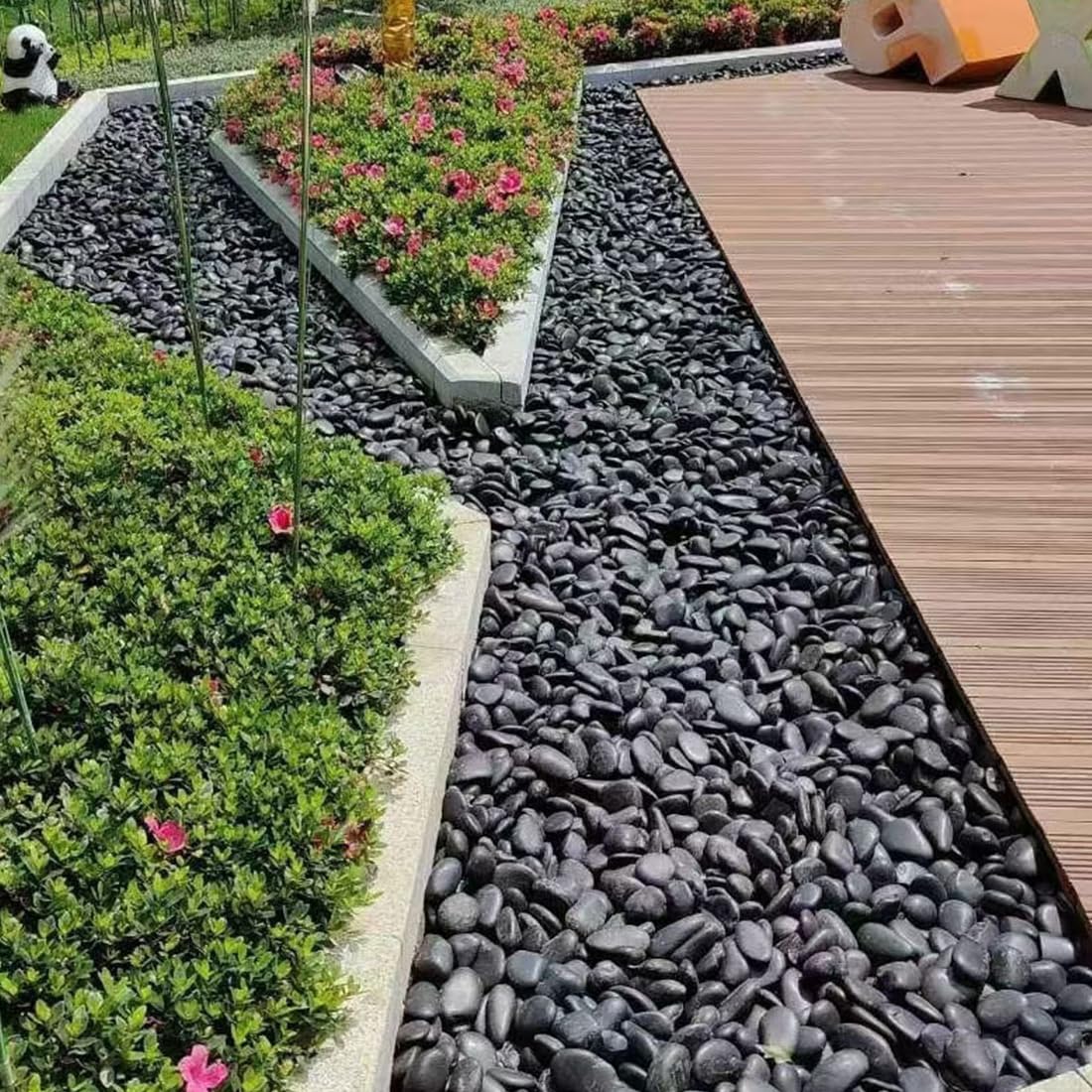 YISZM pebbles in ceramic planter demonstrating improved drainage aesthetic