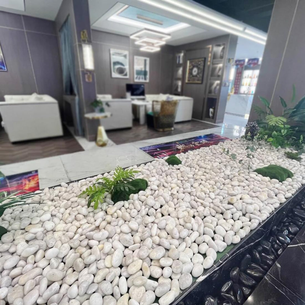 YISZM river rocks lining a pond edge enhancing water-feature aesthetics
