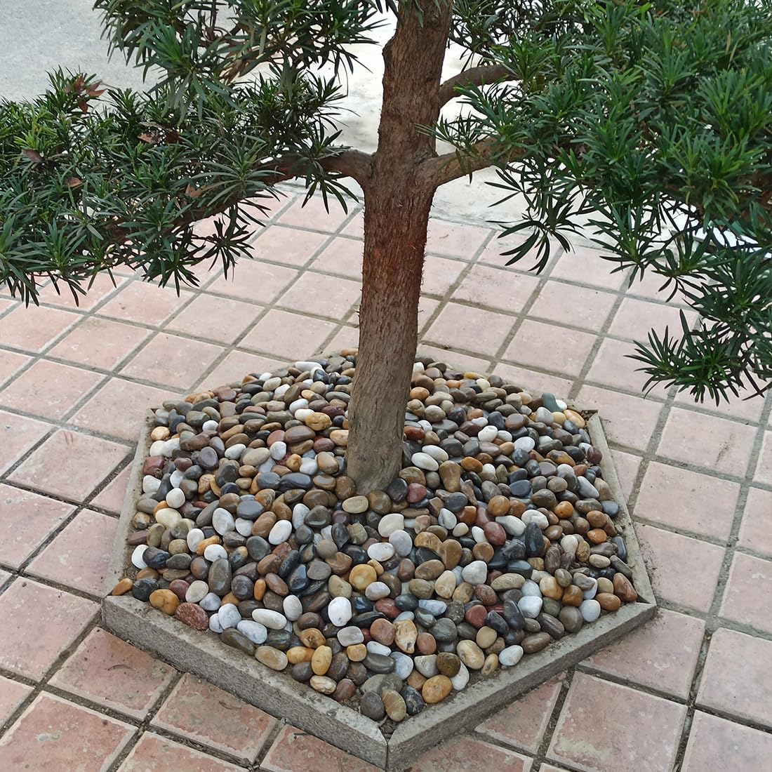 YISZM stones used as vase filler adding decorative weight and moisture retention