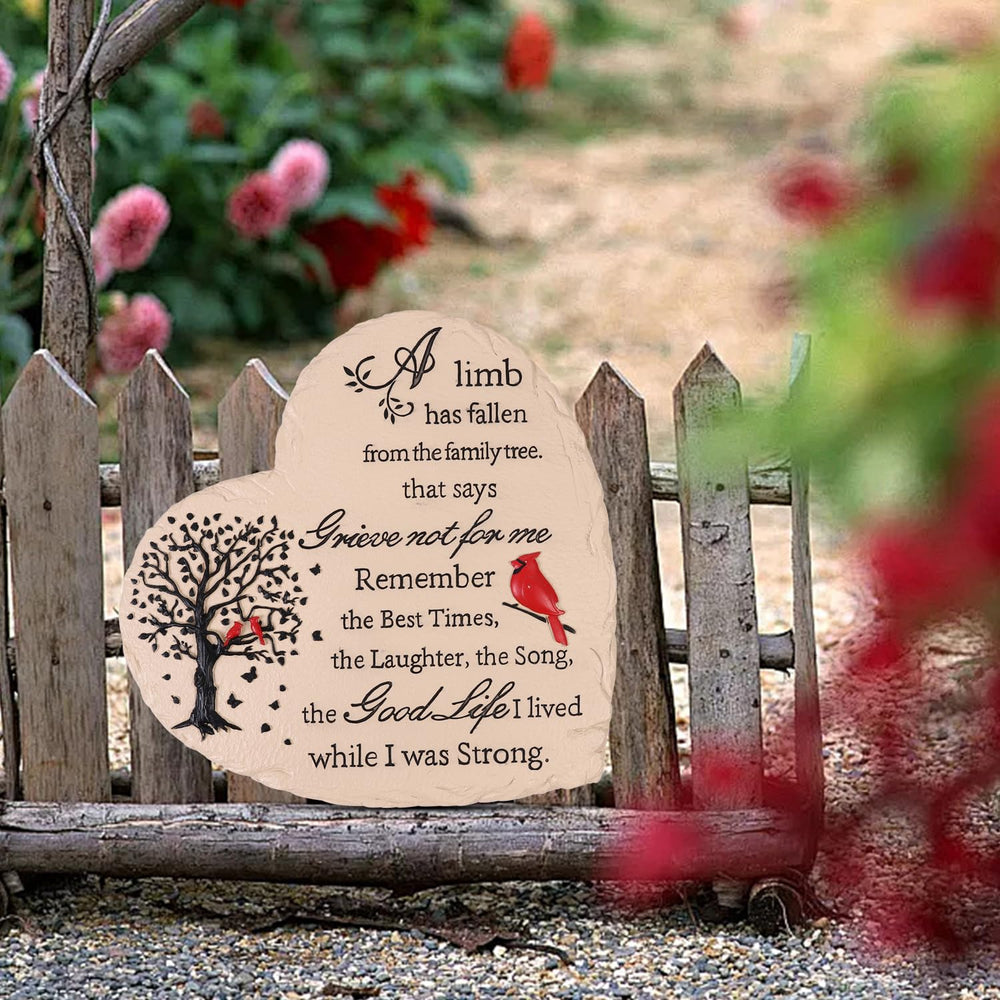 Youdear Memorials heart stone placed in garden among flowers for peaceful remembrance