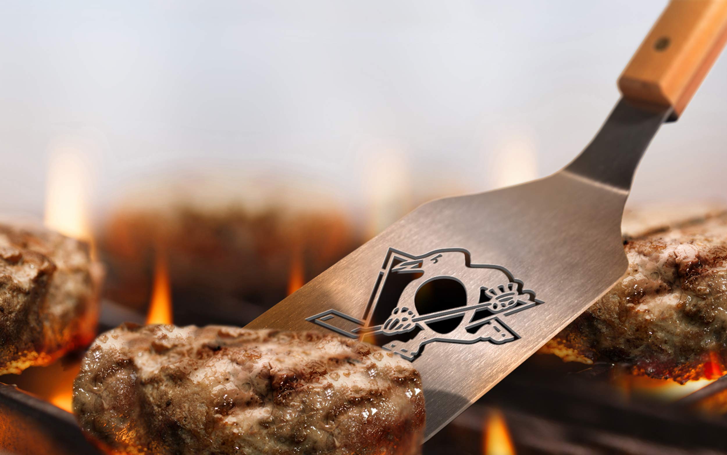 YouTheFan detailed shot of tongs gripping burger shows secure hold and durable build