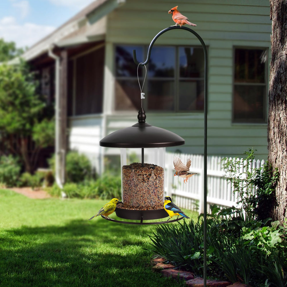 Youvip metal bird feeder in garden setting blending with plants and attracting wildlife