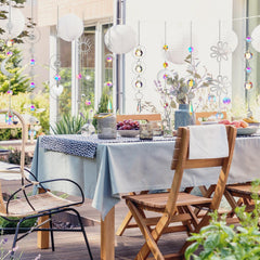 Ysleen crystal suspended from plant pot adding sparkle and uplifting balcony plants