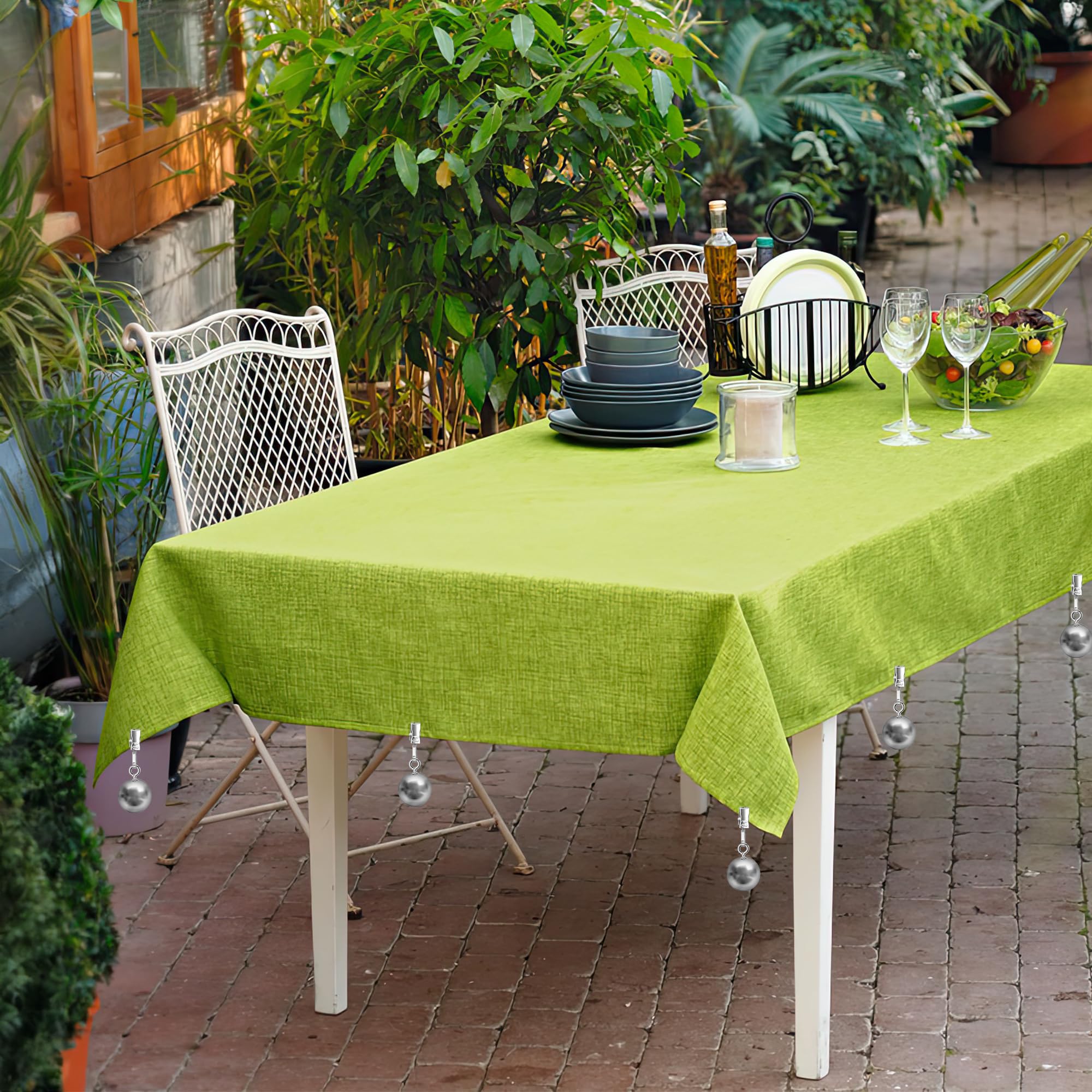 Yteseery weight clipped to tablecloth corner preventing wind lift outdoors