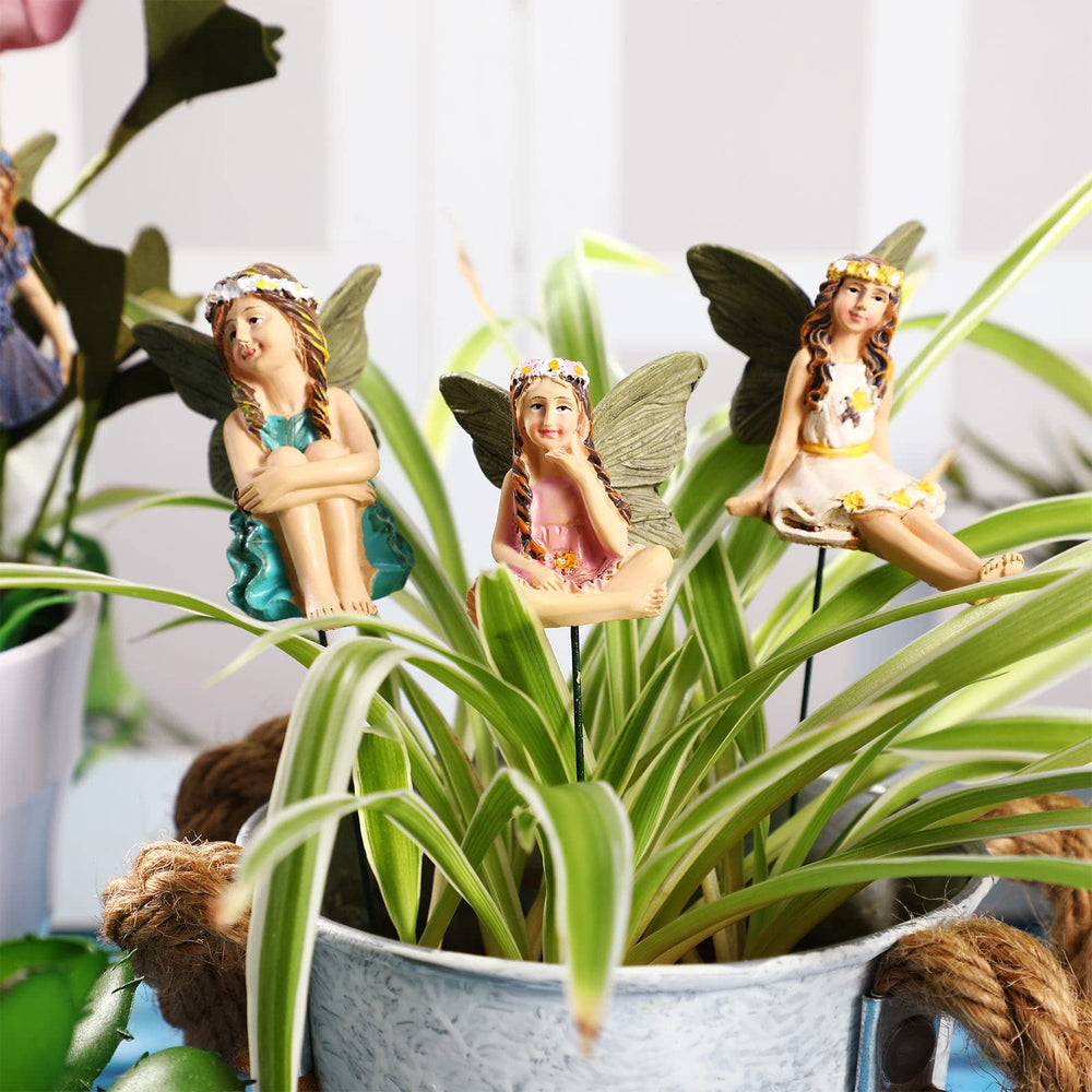 Yulejo grouped fairies inside a terrarium creating a focal miniature scene