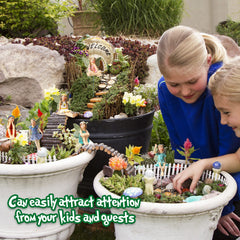 Yulejo miniatures arranged along a pathway adding whimsical garden interest