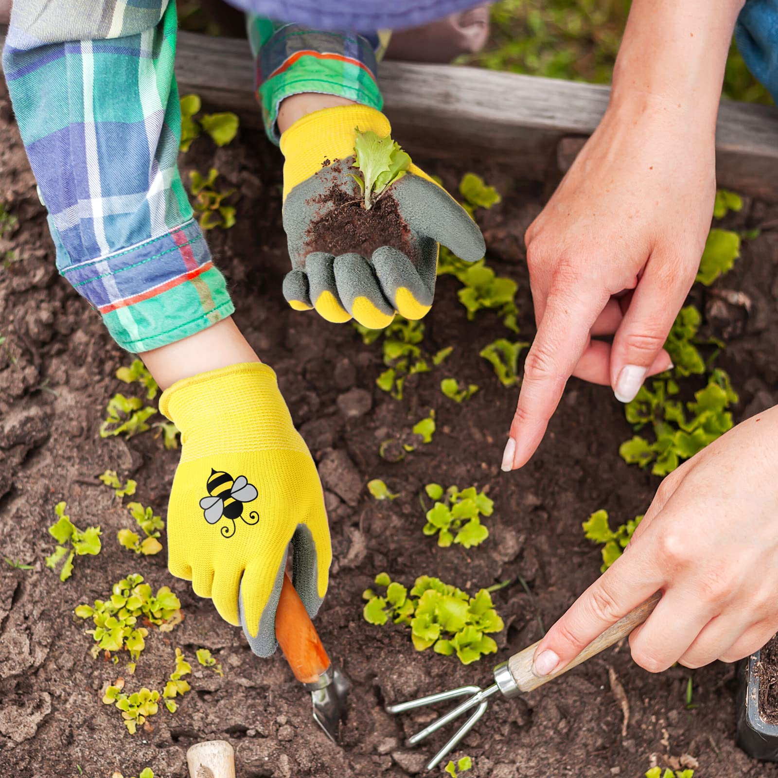 Yumoin gloves worn by child planting seedlings demonstrating safe hand protection