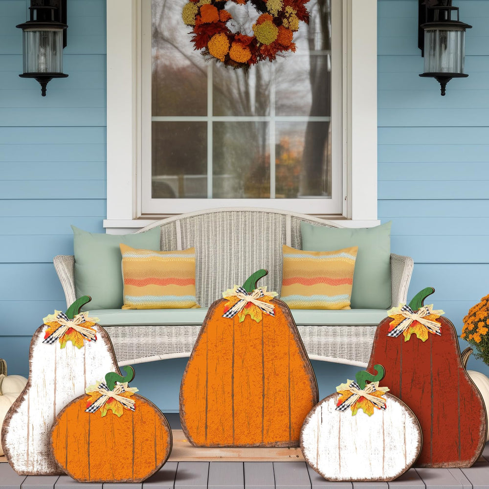 Yuntau pumpkins displayed with mums to enhance porch seasonality