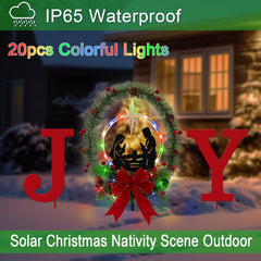 YY Gardenia lights lit at night along a pathway creating colorful festive illumination