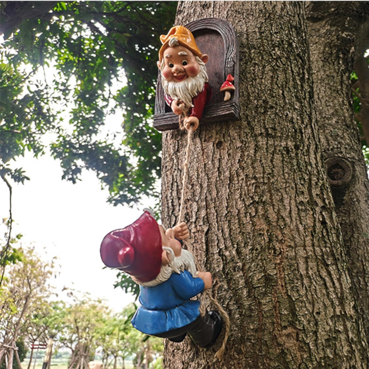 ZEshops front view of two resin climbing gnomes showing whimsical garden charm