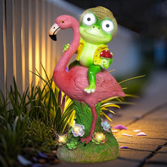 ZFNN front view of frog riding flamingo, playful garden accent and lighting