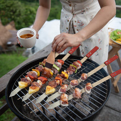 Zhehao skewers loaded and grilling for even-cooking benefit