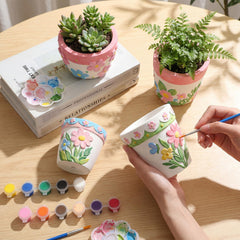 Zubebe hands painting a pot demonstrating creative personalization and group use